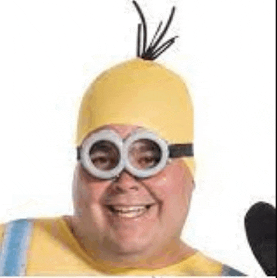 a man in a minion costume is smiling and wearing a hat and goggles .