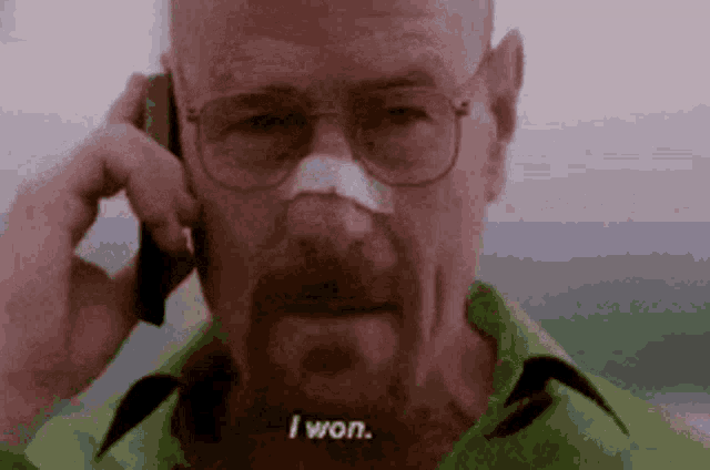 a man with a bandage on his nose is talking on a cell phone and saying `` i won '' .