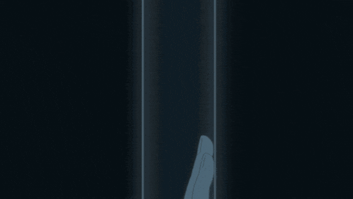 a person 's hand is touching another person 's hand in the dark