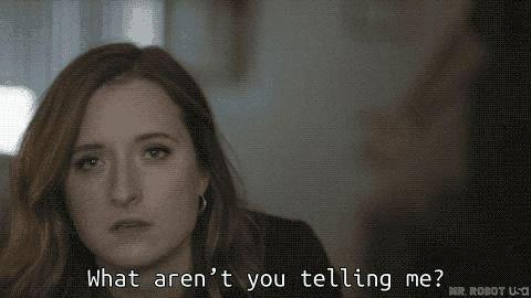 a close up of a woman 's face with the words `` what are n't you telling me ? ''