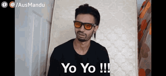a man wearing glasses and a black shirt says yo yo !!!