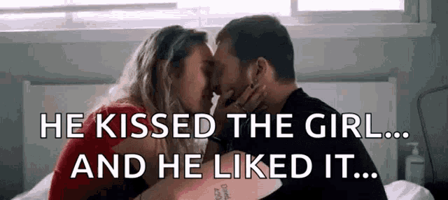 a man and a woman are kissing on a bed with the words `` he kissed the girl and he liked it '' .