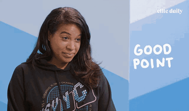 a woman wearing a hoodie that says ' good point '