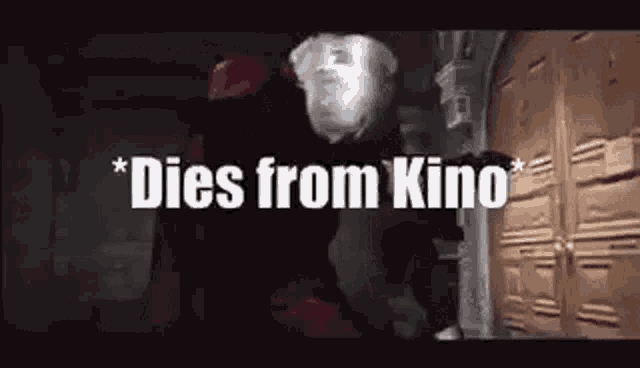 a man in a red hat is standing in front of a door with the words `` dies from kino '' written above him .
