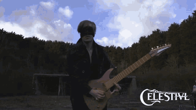 a man playing a guitar with the word celestivl on the bottom right