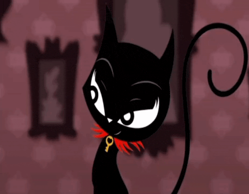 a black cat with a red collar and a key on its neck