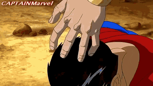 a cartoon of a hand touching a person 's head with the caption captain marvel