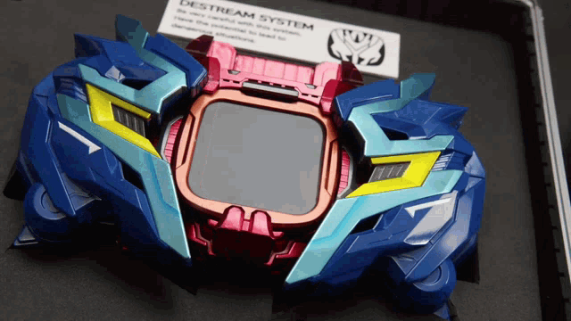 a blue and red item with a destream system label on it