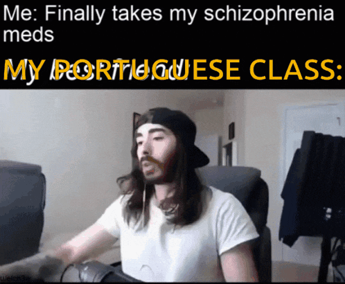 a man with long hair is sitting in front of a computer with a caption that says me finally takes my schizophrenia meds