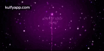 a purple fireworks display with the words `` happy new year ''