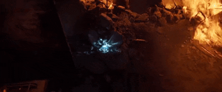 a person is holding a blue light in their hand .
