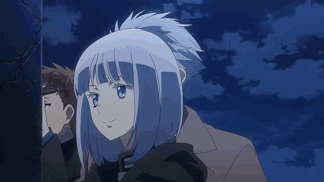 a man and a woman are standing next to each other in a dark room