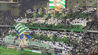 a stadium full of people with a banner that says ' from you '