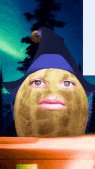 a peanut wearing a purple hat looks at the camera