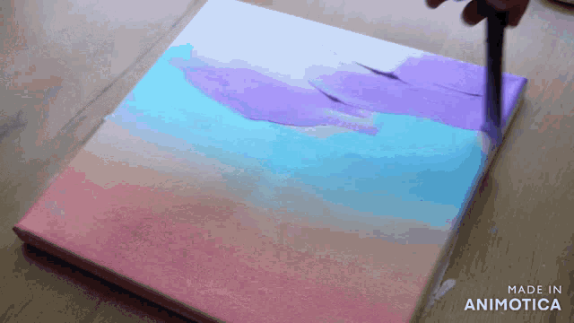 a painting is being painted on a canvas with the words made in animotica on the bottom