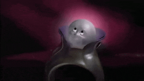 a cartoon character is sitting on a ring with a purple collar and a white face .