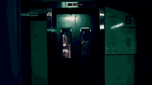 an elevator with the number 6 on the side
