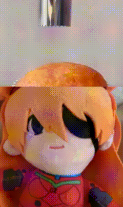 a close up of a stuffed animal with a cartoon character on it .