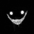 a black and white image of a smiling monster with sharp teeth and glowing eyes .