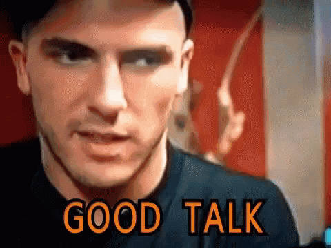a close up of a man 's face with the words good talk written above him