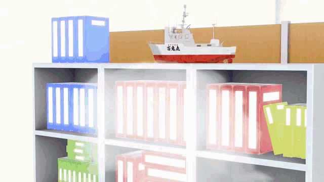 a model of a ship is on top of a shelf full of binders