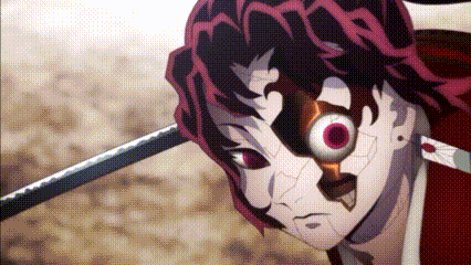 a close up of a person holding a sword in their hand and looking at the camera .
