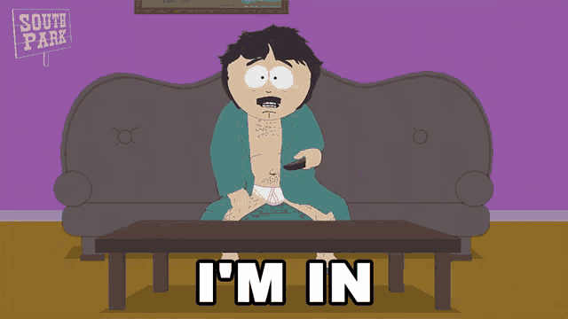 a cartoon character from south park sits on a couch holding a remote control