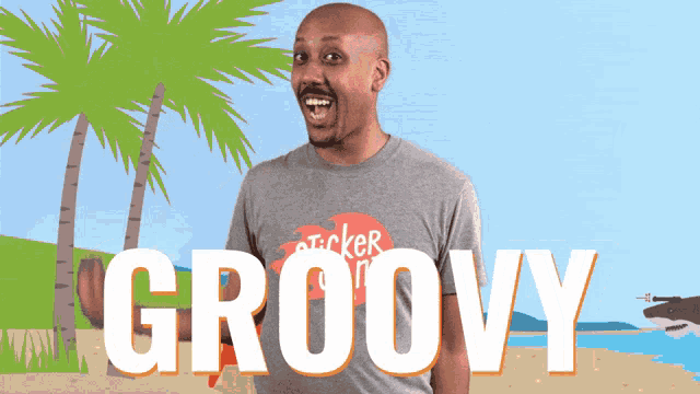 a man wearing a gray shirt that says groovy on it
