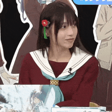 a girl with a red flower in her hair is wearing a sailor outfit