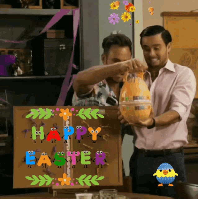 two men holding an easter egg in front of a board that says happy easter