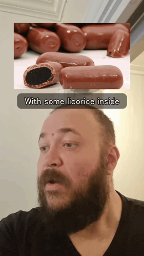 a man with a beard is looking at a picture of sausages with the caption with some licorice inside