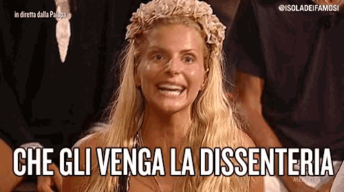 a woman with a flower crown on her head is smiling and says che gli venga la dissenteria .