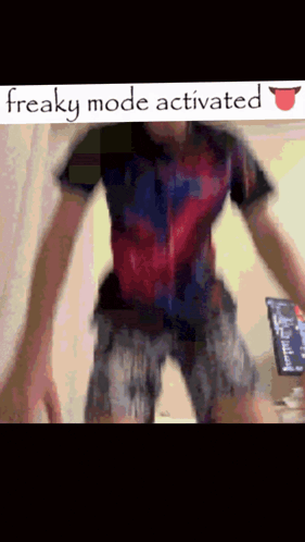 a man is standing in front of a sign that reads " freaky mode activated "