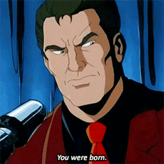a man in a red suit and tie says you were born
