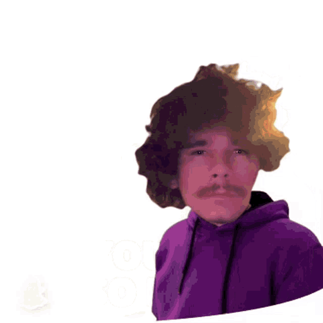 a man wearing a purple hoodie is making a stop sign with his hand