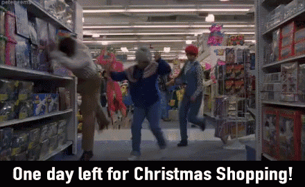 a group of people are dancing in a store with the words one day left for christmas shopping below them
