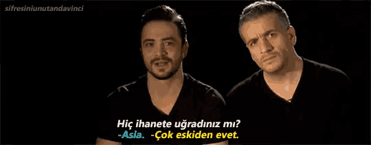 two men are standing next to each other with one saying hiç ihanete ugradiniz mi