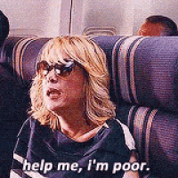 a woman is sitting on a plane wearing sunglasses and saying `` help me , i 'm poor '' .