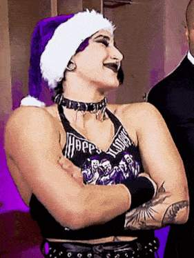 a woman wearing a santa hat and a shirt that says hope