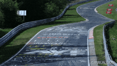 a race track with a sign that says ' gifrun.com ' on it