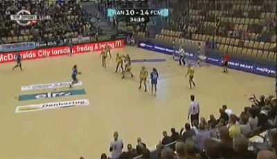 a soccer game is being played in front of a crowd with ads for mcdonald 's and acdc