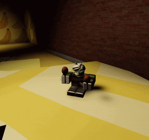 a cartoon character is sitting on a yellow and white tiled floor