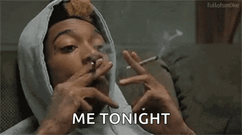 a man in a hooded jacket is smoking a cigarette and saying `` me tonight '' .