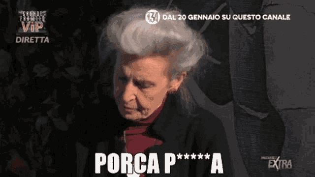 a woman with gray hair says porca p*** a