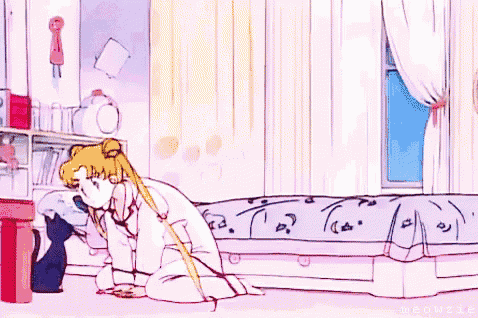 a girl is jumping on a bed in a room with a black cat .