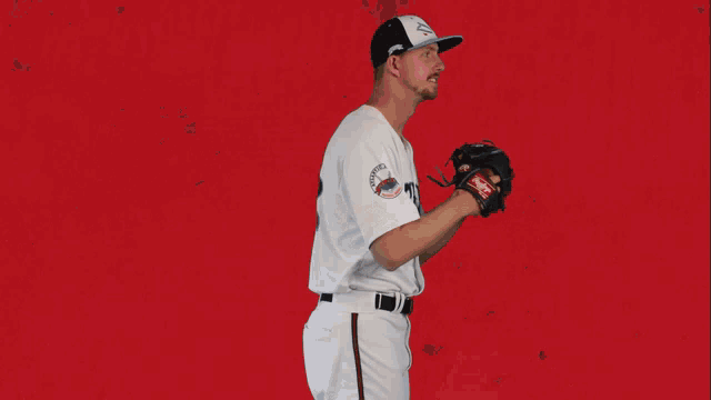 a baseball player wearing a white shirt with the number 8 on it