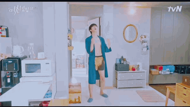 a man is dancing in a living room with tvn written on the bottom