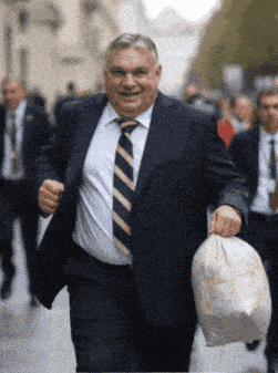 a man in a suit and tie is running while holding a bag of trash