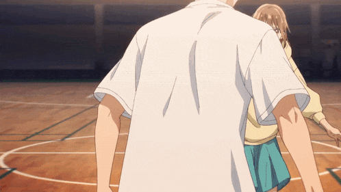 a man and a woman are playing basketball on a court and the man is wearing a white shirt