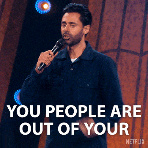 a man speaking into a microphone with the words you people are out of your